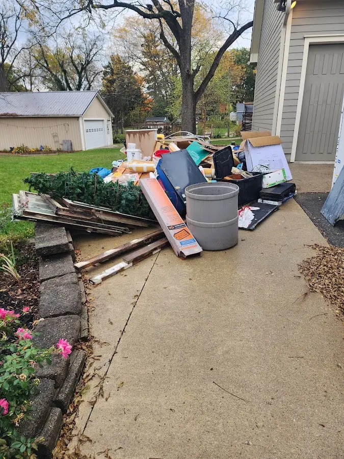 Dumpster being loaded with debris for 30 Yard Dumpster Rental in West Falls Church